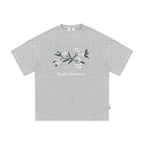 The Snowfall Sakura Tee - Textured Snow Fabric with Hand-Drawn Cherry Blossom