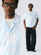 The Scattered Petal Shirt - Sky Blue Full-Print with Hand-Drawn White Flowers