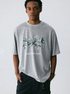 The Snowfall Sakura Tee - Textured Snow Fabric with Hand-Drawn Cherry Blossom
