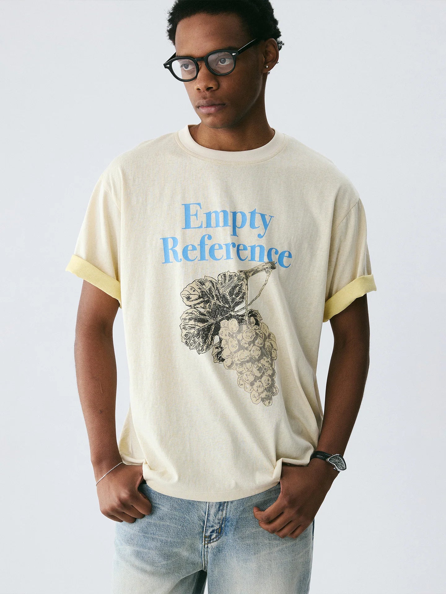 The Sketch Grape Bunch Tee - Apricot Snow Fabric with Charcoal-Style Grape Cluster & Blue Logo