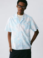 The Scattered Petal Shirt - Sky Blue Full-Print with Hand-Drawn White Flowers