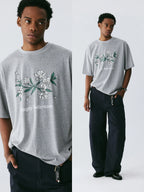 The Snowfall Sakura Tee - Textured Snow Fabric with Hand-Drawn Cherry Blossom