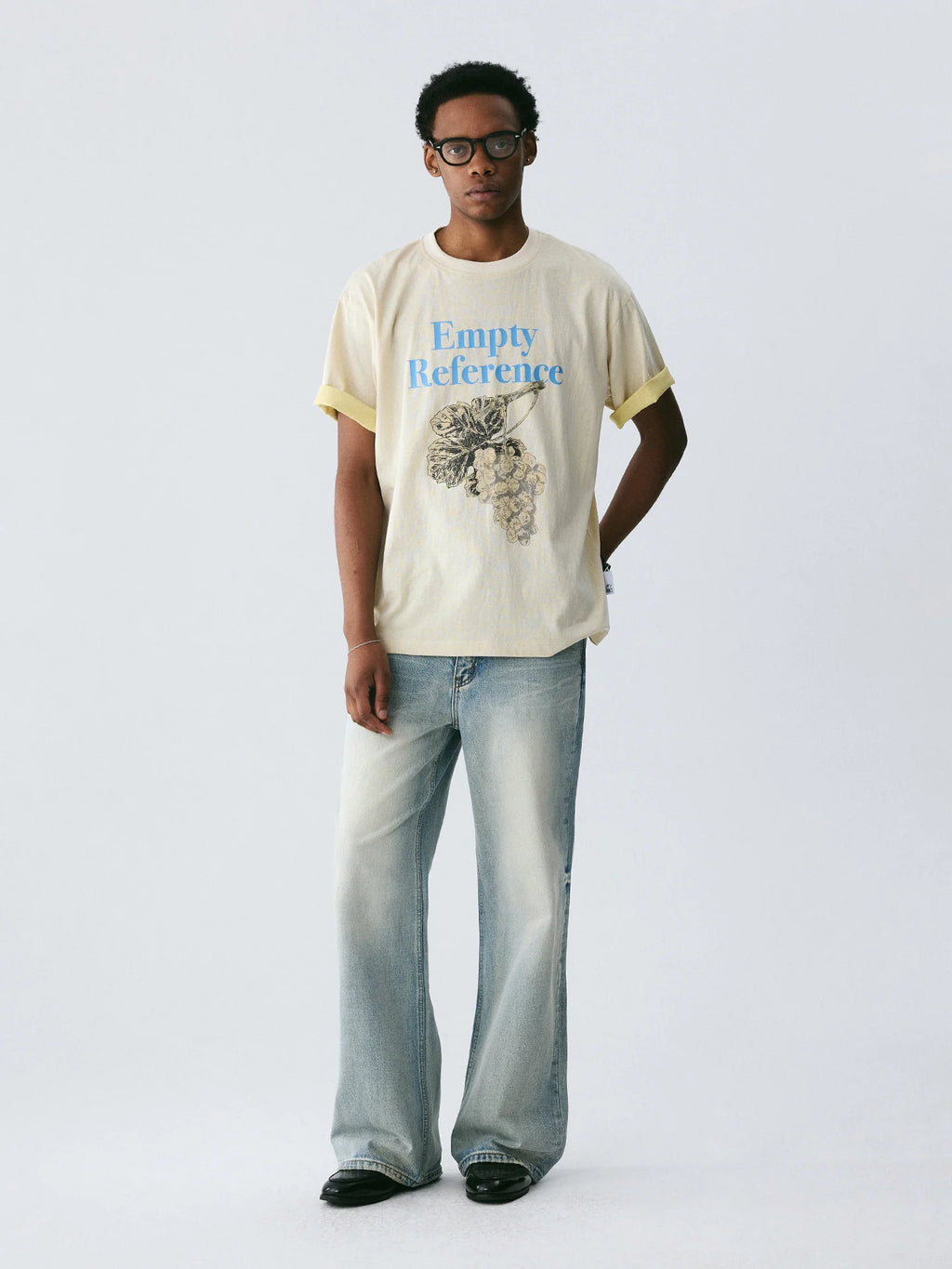 The Sketch Grape Bunch Tee - Apricot Snow Fabric with Charcoal-Style Grape Cluster & Blue Logo