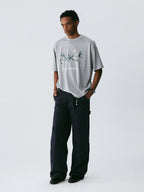 The Snowfall Sakura Tee - Textured Snow Fabric with Hand-Drawn Cherry Blossom