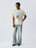 The Sketch Grape Bunch Tee - Apricot Snow Fabric with Charcoal-Style Grape Cluster & Blue Logo