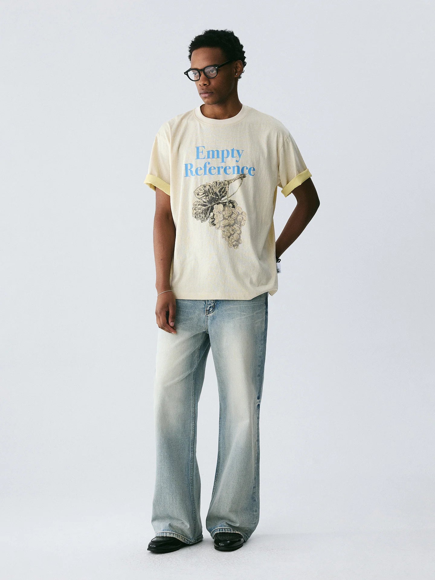 The Sketch Grape Bunch Tee - Apricot Snow Fabric with Charcoal-Style Grape Cluster & Blue Logo